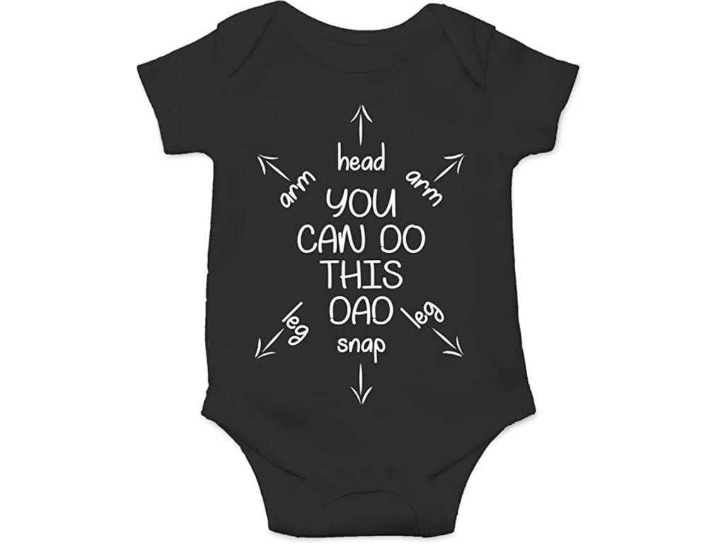 black baby onesie with the words you can do this dad and arrows with labels pointing to the arms, legs, and head holes.