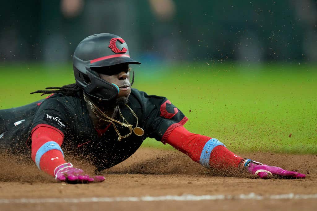 Elly De La Cruz sliding into 3rd base.