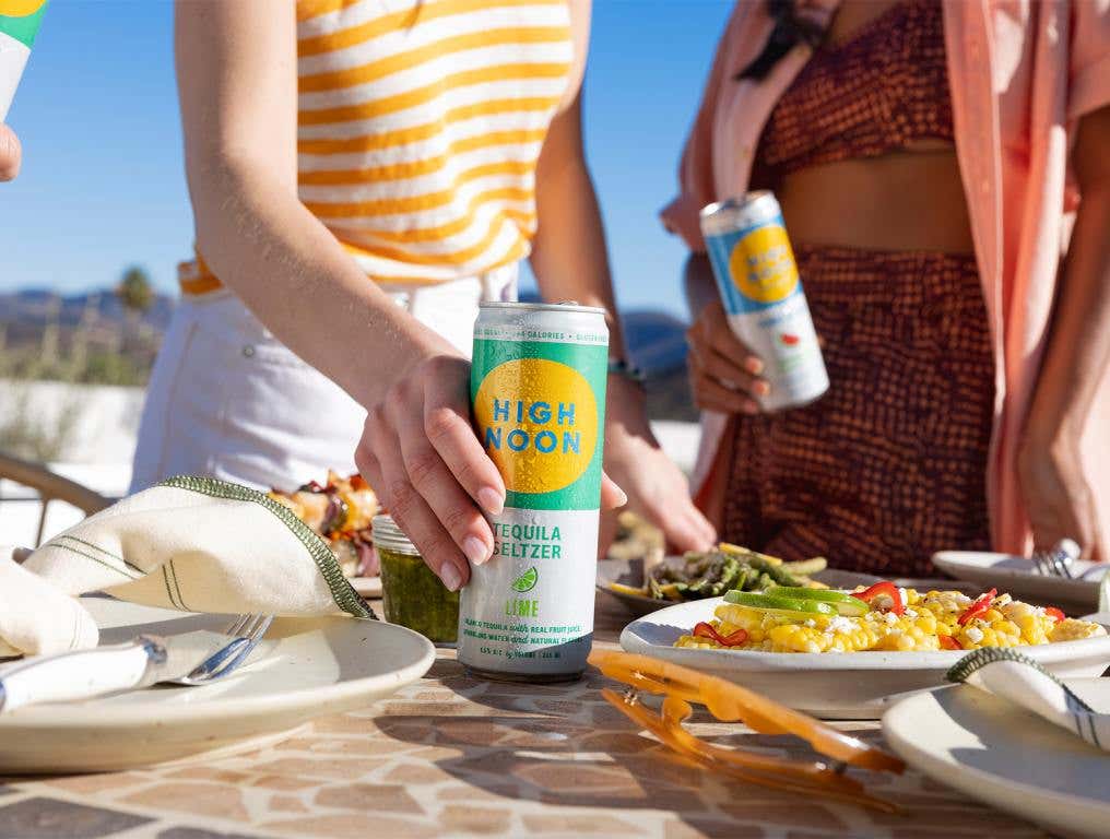 Summer Seltzer High Noon on the table. Article on top hard seltzers.