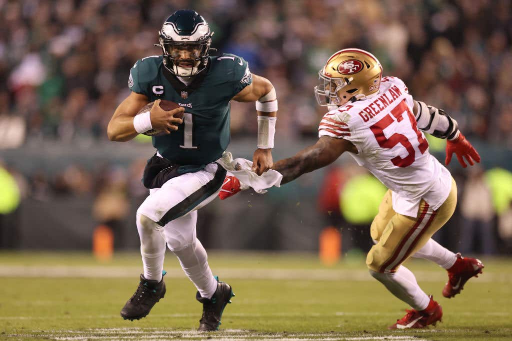 Jalen Hurts #1 of the Philadelphia Eagles runs the ball against Dre Greenlaw #57 of the San Francisco 49ers during the third quarter in the NFC Championship Game at Lincoln Financial Field on January 29, 2023 in Philadelphia, Pennsylvania. (Photo by Tim Nwachukwu/Getty Images)