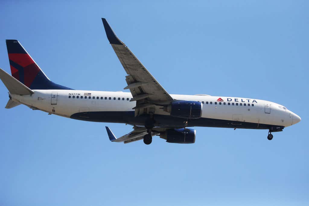 A Delta Air Lines plane lands at Los Angeles International Airport