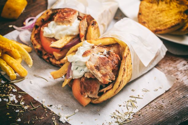 two gyro sandwiches on a cutting board. Things to do on a weekeend