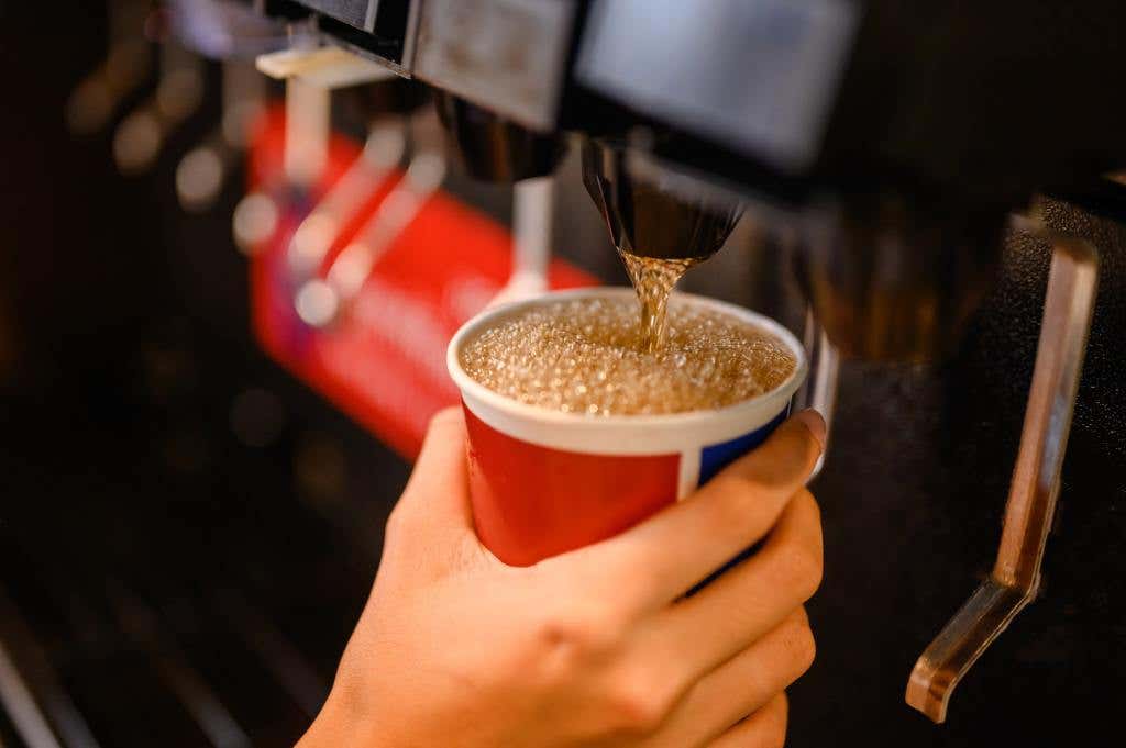 Man pours a fizzy drink Swig Drinks Florida