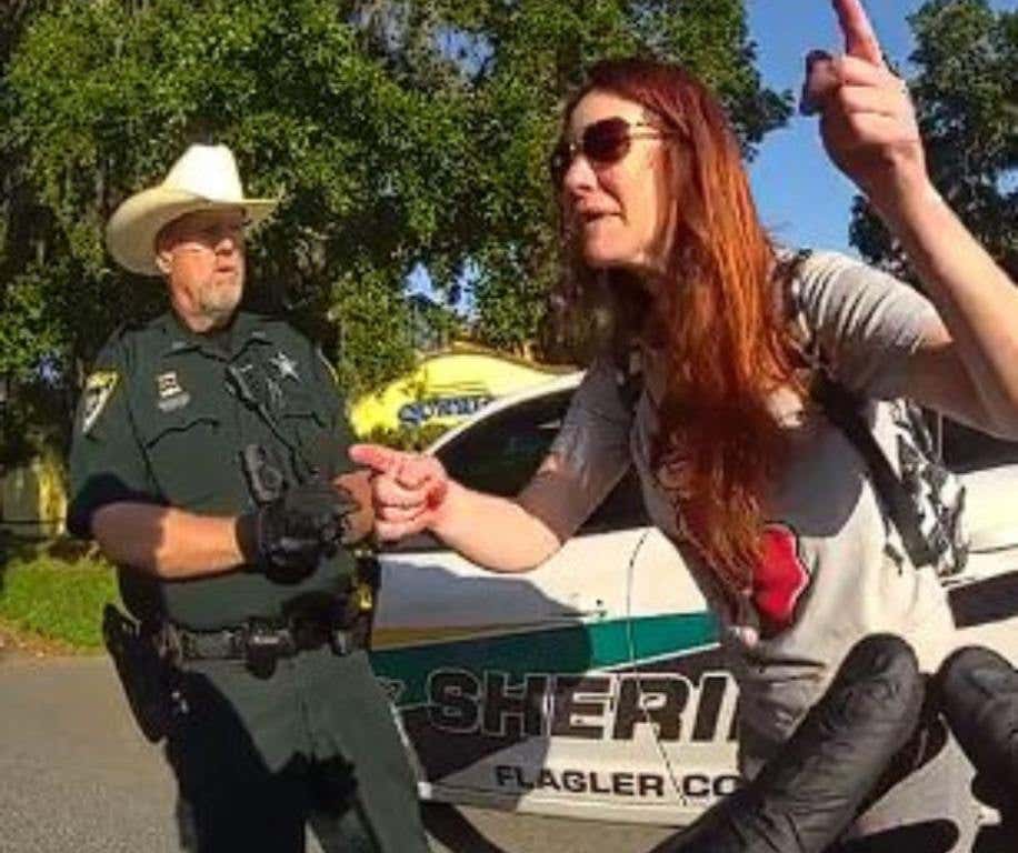 Caught on camera, a drunk Florida woman spits on deputies, screams angrily, and bangs her head during arrest.