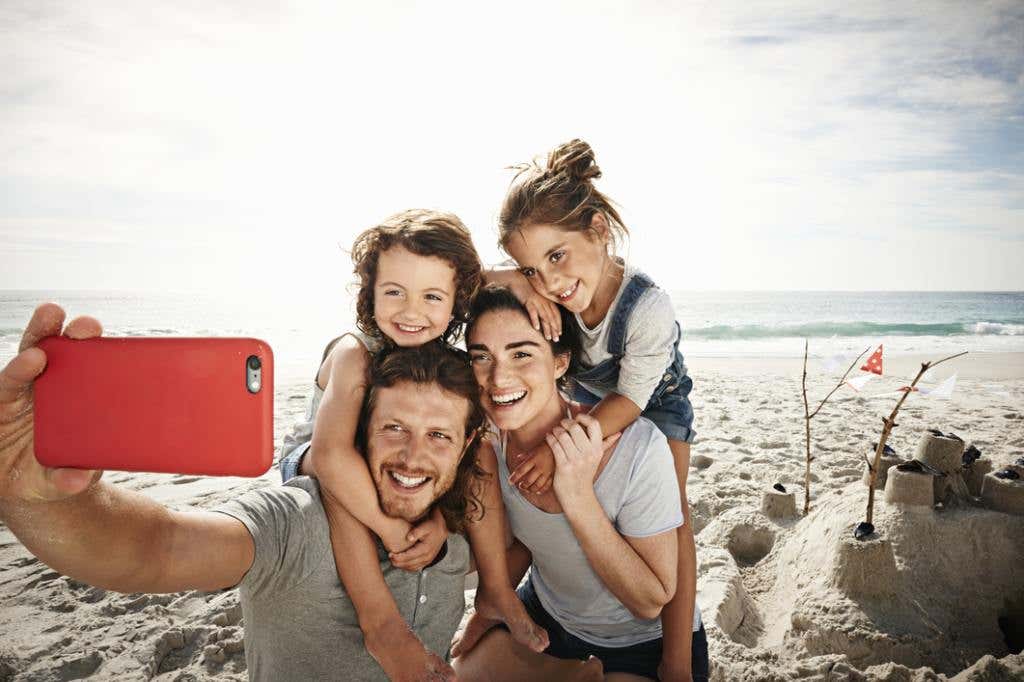 Selfie obsessed family on the beach in Florida