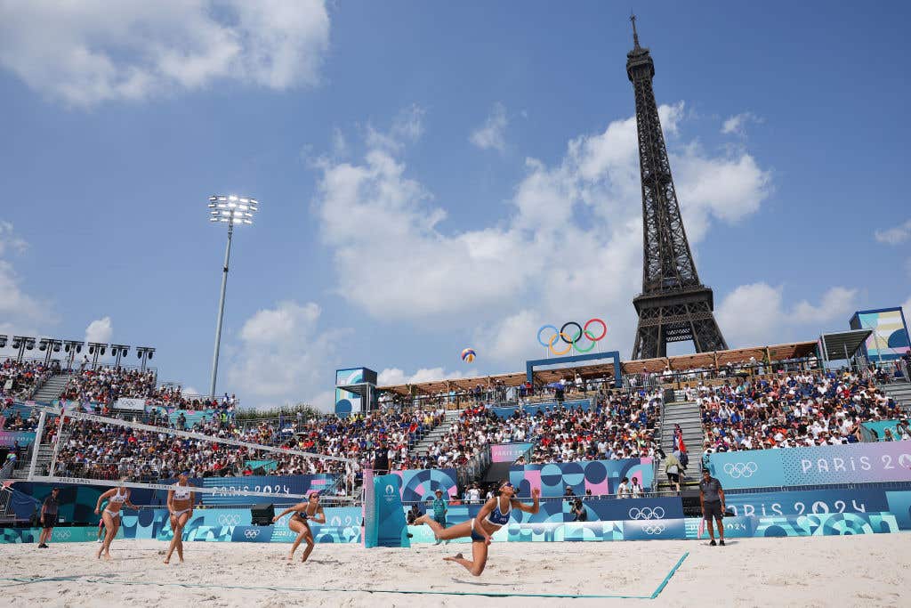 General view inside the arena as Clemence Vieira of Team France competes as the Eiffel Tower is seen in the background during the Men's Preliminary Phase - Pool B match between Team France and Team Czechia on day seven of the Olympic Games Paris 2024 at Eiffel Tower Stadium