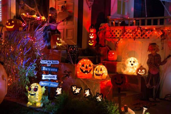 A home decorated for Halloween with glowing pumpkins and ghosts for Halloween Week in SWFL