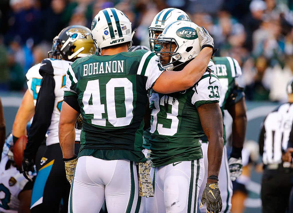 Chris Ivory #33 of the New York Jets is congratulated by his teammate Tommy Bohanon #40 after scoring a third quarter touchdown against the Jacksonville Jaguars Stadium on November 8, 2015 in East Rutherford, New Jersey.