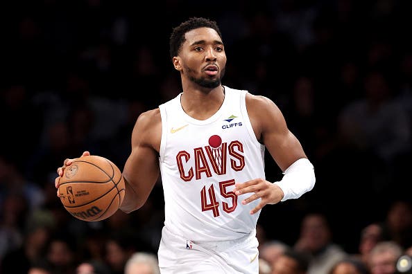 Donovan Mitchell #45 of the Cleveland Cavaliers dribbles the ball