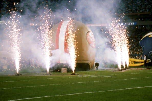 General view of pre-game festivities with fireworks and huge inflatables of each teams helmets prior to Super Bowl XXIX between the San Diego Chargers and the San Francisco 49ers at Joe Robbie Stadium on January 29, 1995 in Miami, Florida. The 49ers won 49-26.