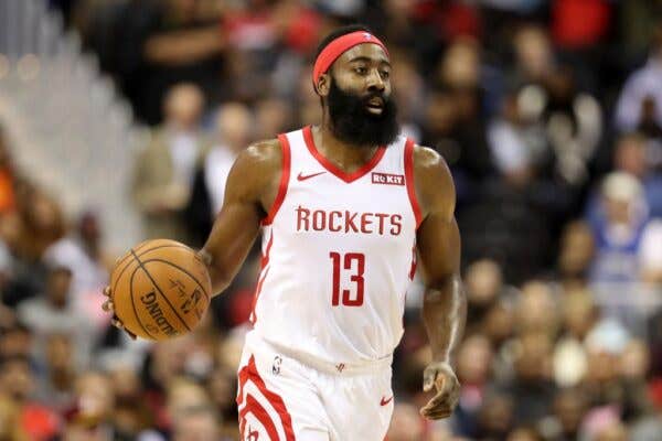 James Harden #13 of the Houston Rockets dribbles the ball down the court.