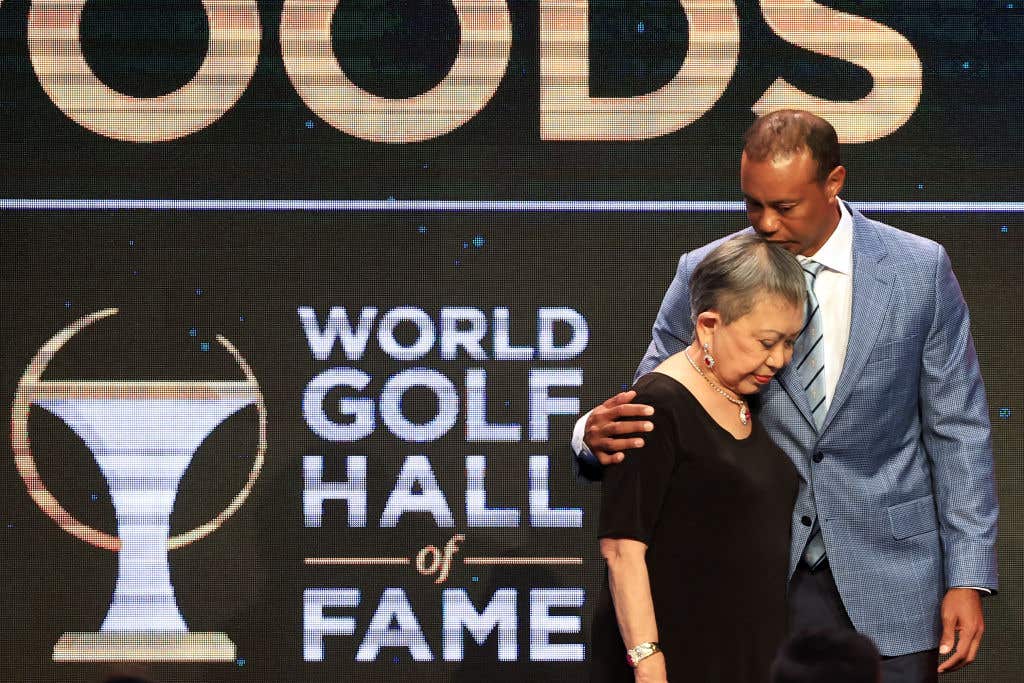 Tiger Woods and his mother Kultida Woods react as they pose for photos prior to his induction at the 2022 World Golf Hall of Fame