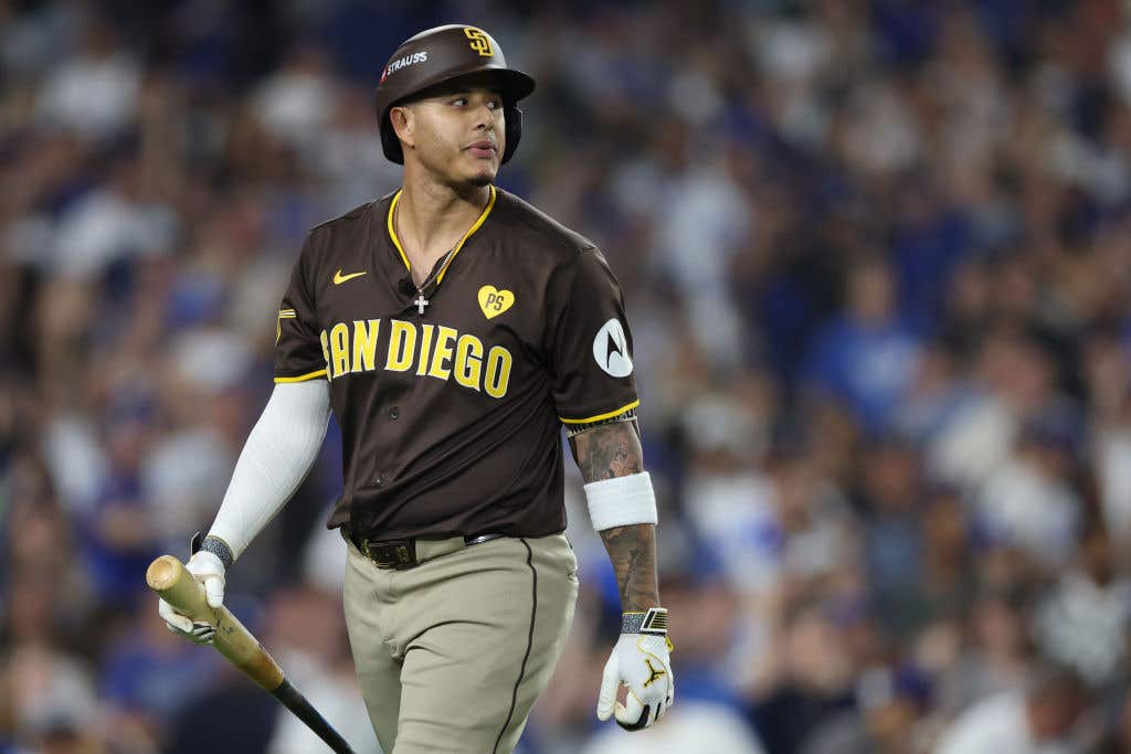 LOS ANGELES, CALIFORNIA - OCTOBER 11: Manny Machado #13 of the San Diego Padres reacts after striking out against the Los Angeles Dodgers during the seventh inning of Game Five of the Division Series at Dodger Stadium on October 11, 2024 in Los Angeles, California