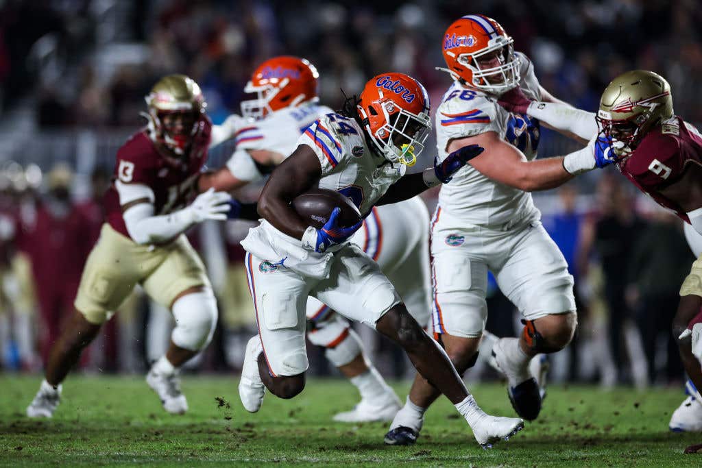 Ja'Kobi Jackson #24 of the Florida Gators runs with the ball during the first half of a game against the Florida State Seminoles at Doak Campbell