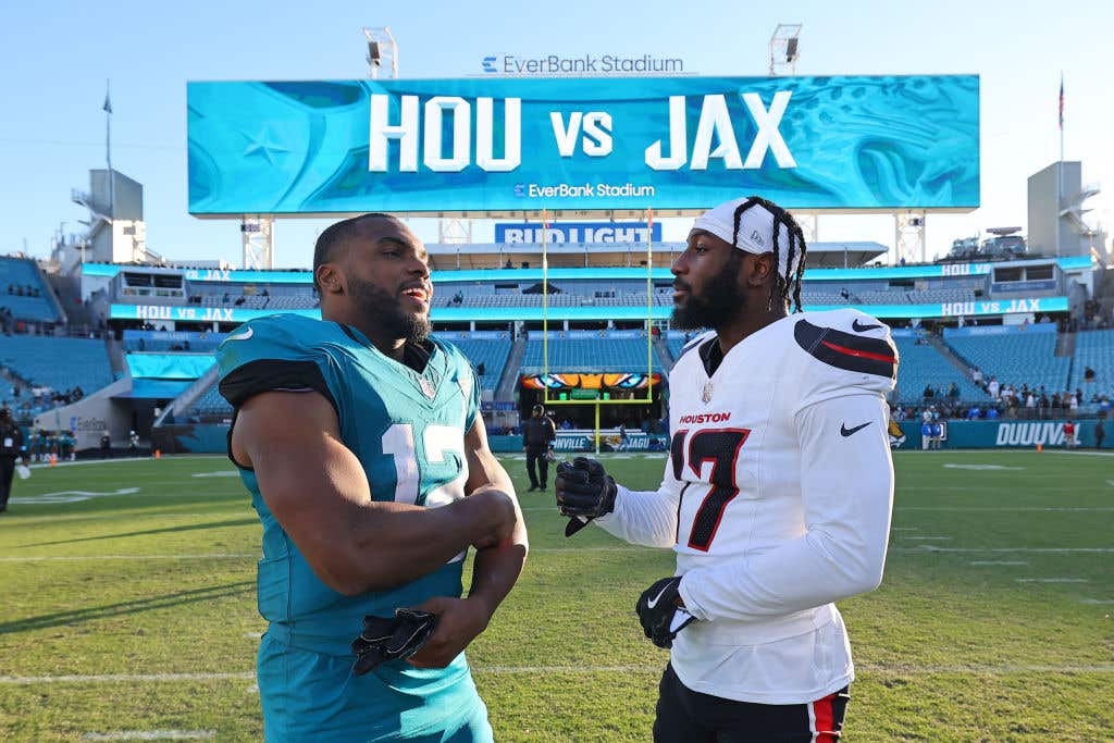 Devin Duvernay #12 of the Jacksonville Jaguars and Kris Boyd #17 of the Houston Texans meet after the game at EverBank Stadium