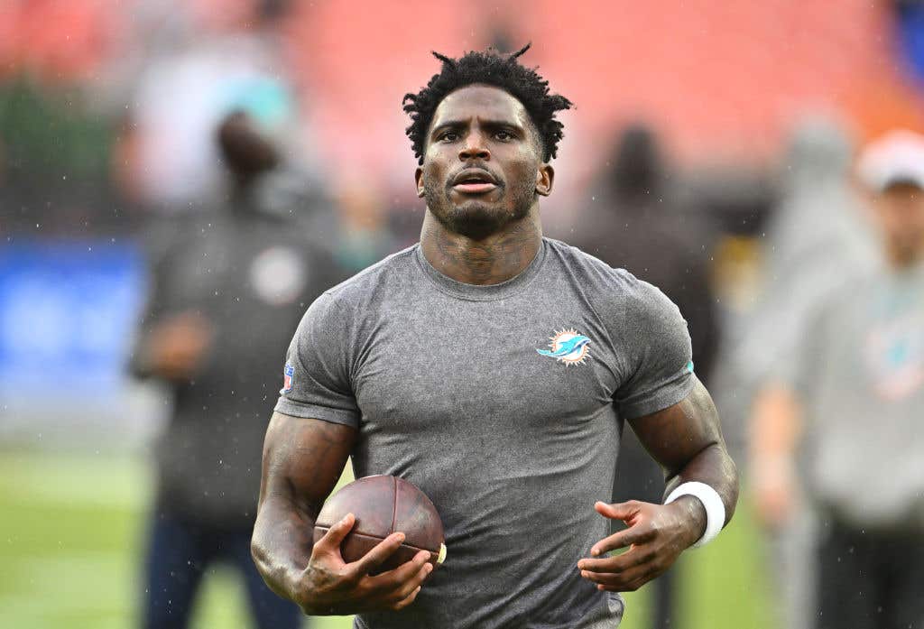 Tyreek Hill #10 of the Miami Dolphins warms up before the game against the Cleveland Browns at Huntington Bank Field