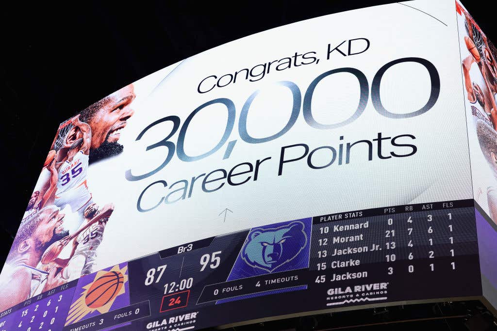 The scoreboard displays Kevin Durant #35 of the Phoenix Suns after he scored his 30,000th career point during the second half of the NBA game against the Memphis Grizzlies at Footprint Center on February 11, 2025