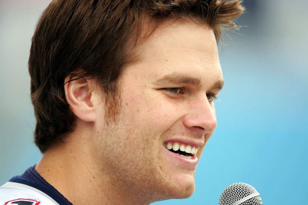 Tom Brady, quarterback of the New England Patriots greets the media at media day prior to the start of Super Bowl XXXIX at Alltel Stadium on February 1, 2005 in Jacksonville, Florida