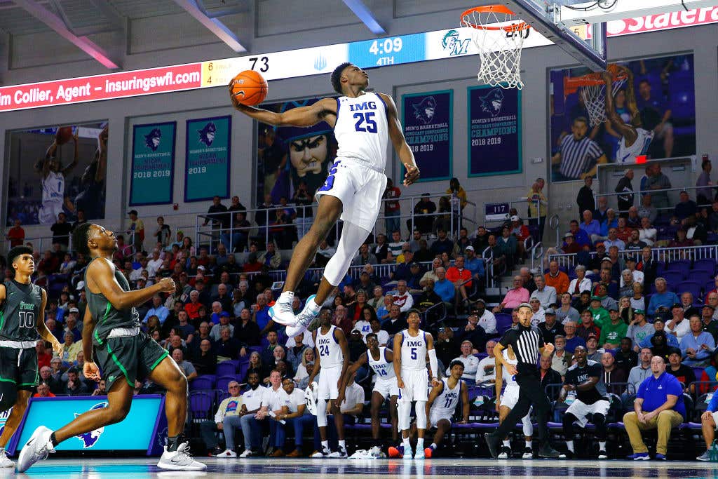 FORT MYERS, FLORIDA - DECEMBER 19: Jarace Walker #25 of IMG Academy goes up for a dunk against Fort Myers High School during the City of Palms Classic Day 2 at Suncoast Credit Union Arena on December 19, 2019 in Fort Myers, Florida.