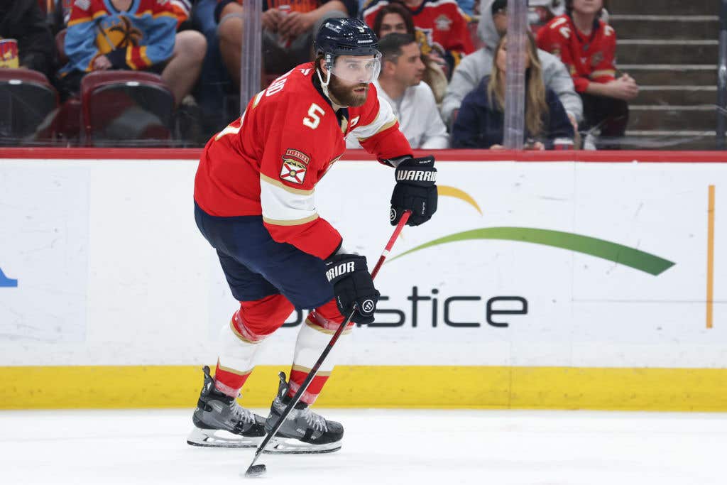 Aaron Ekblad #5 of the Florida Panthers skates with the puck against the Edmonton Oilers