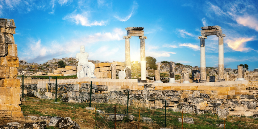 Ancient city of Hierapolis with statue of a Pluto and columns in Pamukkale