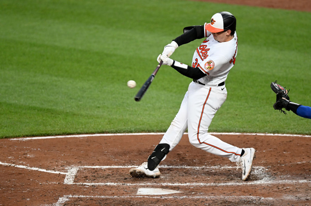 BALTIMORE, MD - APRIL 08: Baltimore Orioles catcher Adley Rutschman (35)  puts his helmet on during the New York Yankees versus Baltimore Orioles MLB  game at Oriole Park at Camden Yards on