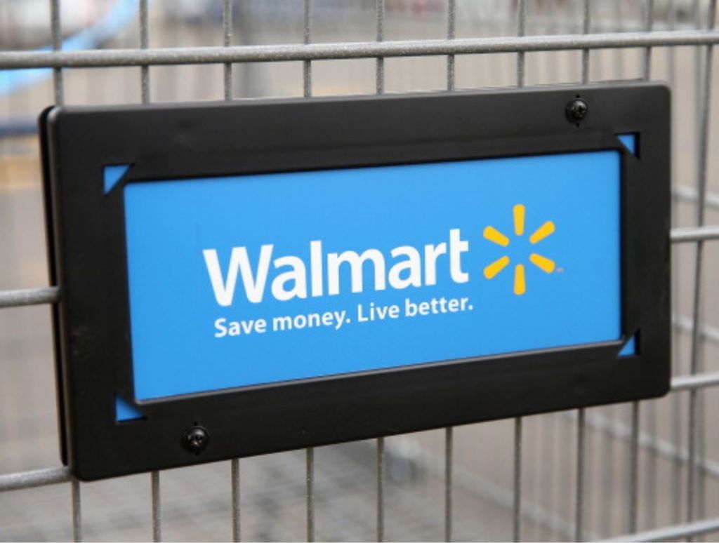 The Walmart logo is displayed on a shopping cart at a Walmart store. Stolen Walmart Scooter