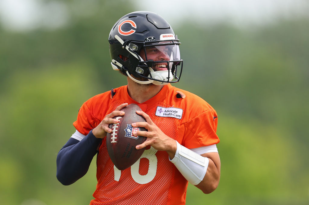 NFL Training Camps Begin. Caleb Williams #18 of the Chicago Bears throws a pass during Chicago Bears Minicamp at Halas Hall on June 04, 2024 in Lake Forest, Illinois.