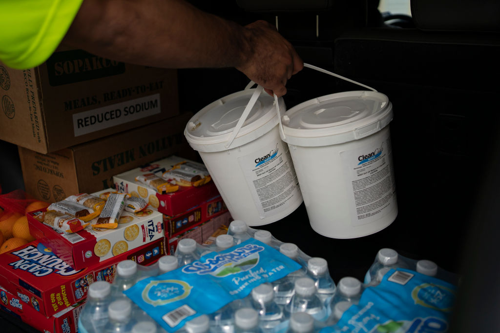 Volunteers and staff of Harris County Precinct One give out donated items, including water, sanitary wipes, and emergency meals, at its Central Service Center on July 11, 2024 in Houston, Texas. Nearly one million people still remain without electricity in the wake of Hurricane Beryl, which was a category one hurricane that made a direct hit on Houston and surrounding areas on July 8, leaving more than two million people without power.