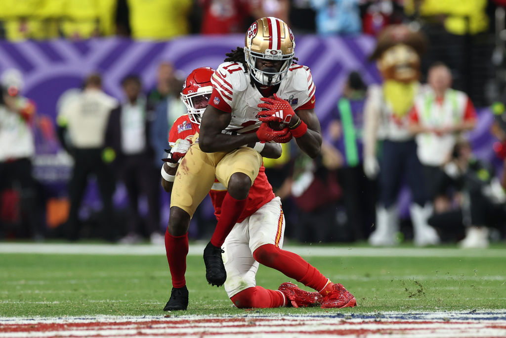 Brandon Aiyuk #11 of the San Francisco 49ers catches a pass for a first down in overtime against the Kansas City Chiefs during Super Bowl LVIII at Allegiant Stadium on February 11, 2024 in Las Vegas, Nevada.