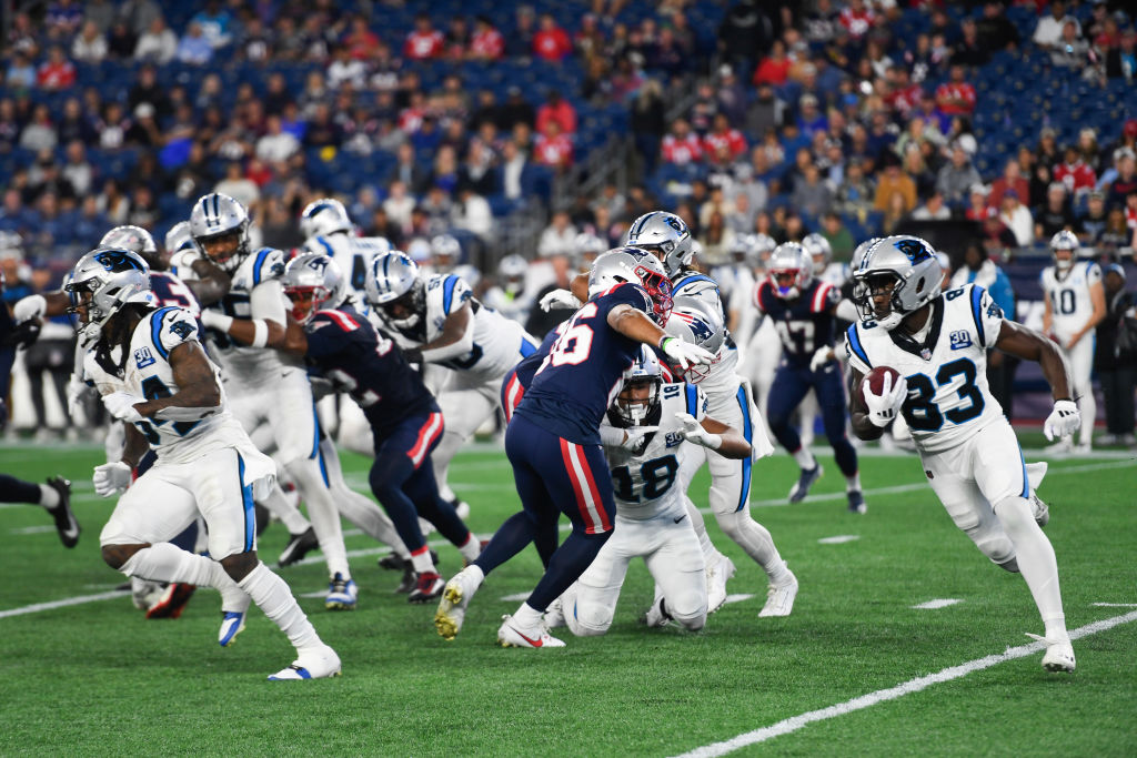 David Moore #83 of the Carolina Panthers sprints with the ball off a kick return during the second half of a preseason game against the New England Patriots at Gillette Stadium on August 08, 2024 in Foxborough, Massachusetts.